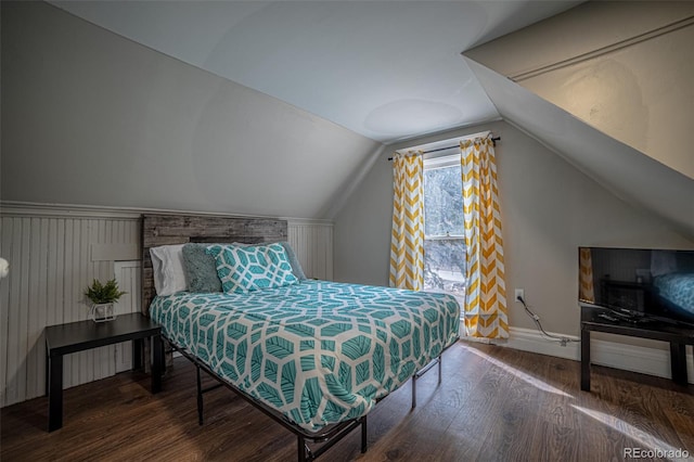 bedroom with lofted ceiling and dark hardwood / wood-style flooring