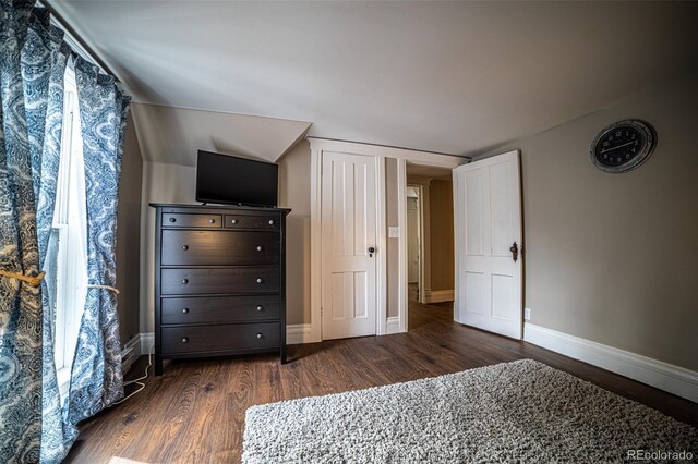 unfurnished bedroom featuring dark wood-type flooring