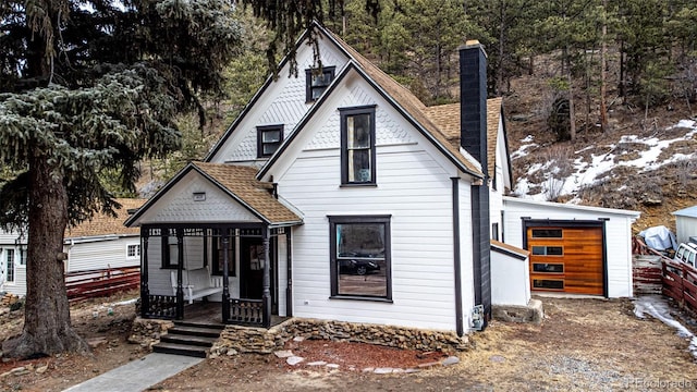 view of front of house with a garage and covered porch