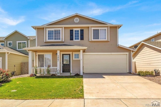 view of property featuring covered porch, a garage, and a front yard