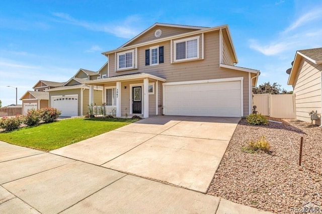 view of front of house with a porch, a garage, and a front lawn