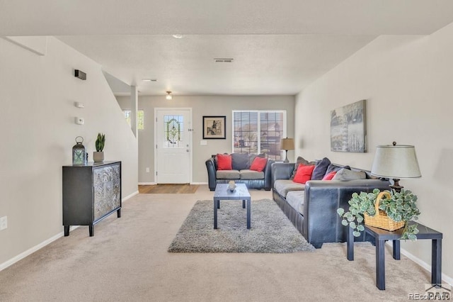 living room featuring light carpet