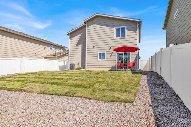 back of property featuring a yard, a patio, and central air condition unit