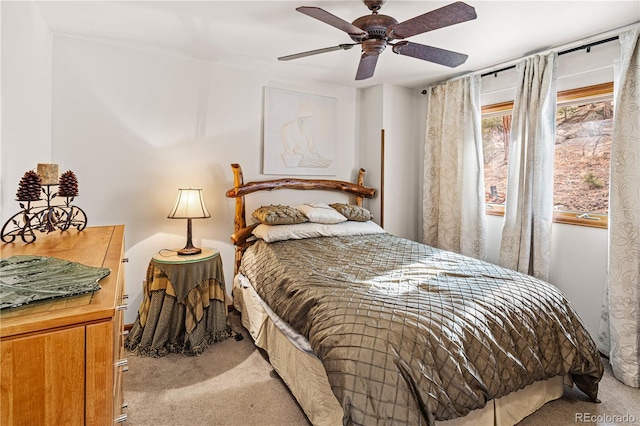 carpeted bedroom featuring a ceiling fan