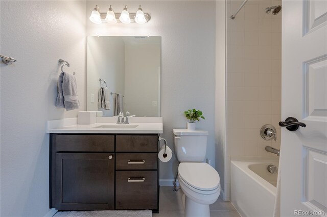 bathroom featuring toilet, vanity, tub / shower combination, and tile patterned floors
