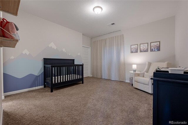 bedroom with visible vents, baseboards, and carpet floors