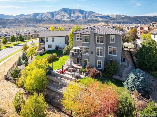 birds eye view of property with a mountain view