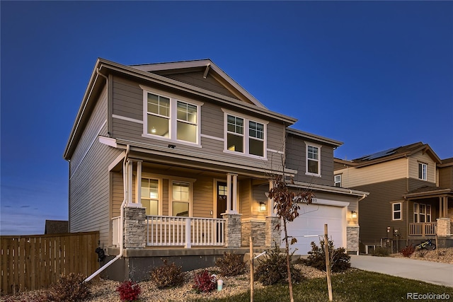 craftsman house with a garage and covered porch