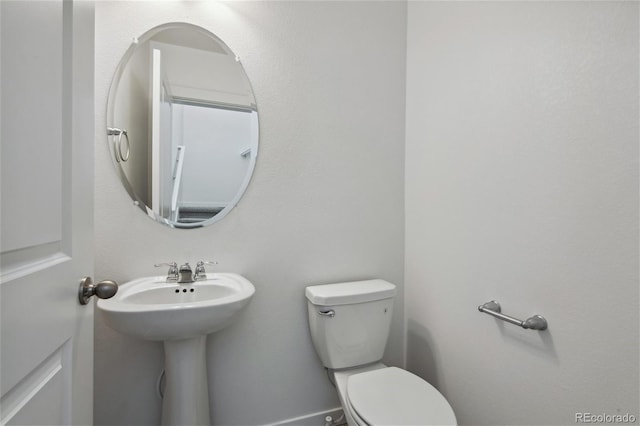 half bathroom with toilet