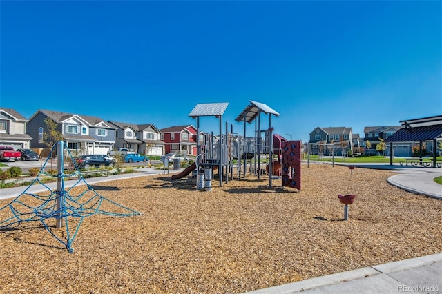 communal playground featuring a residential view