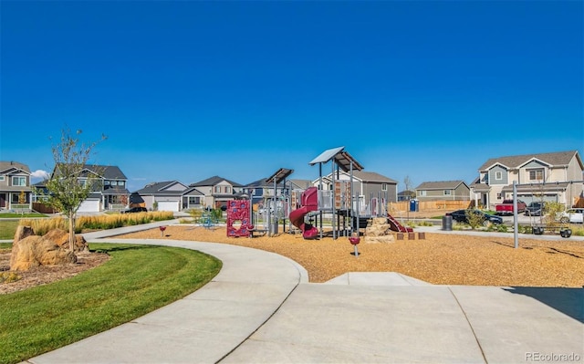 view of play area with a residential view