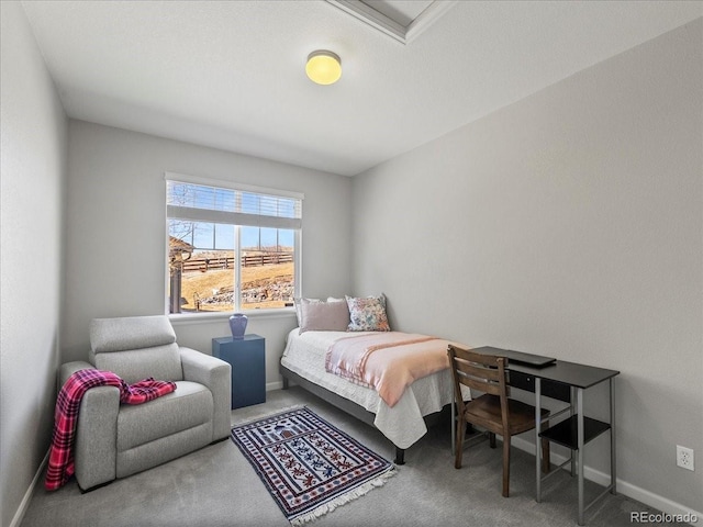 carpeted bedroom featuring baseboards