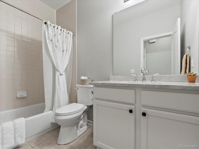 bathroom with shower / tub combo with curtain, vanity, toilet, and tile patterned floors