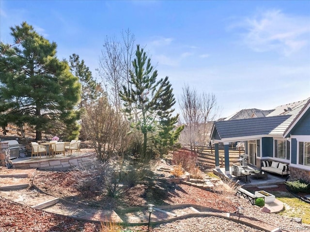 view of yard featuring a patio area and fence