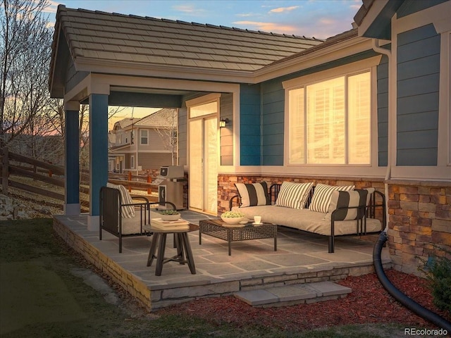 23327 E Ottawa Dr, Aurora, CO 80016 - patio terrace at dusk featuring a patio area, an outdoor hangout area, and grilling area