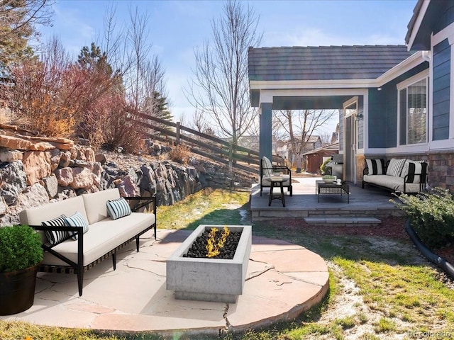 23327 E Ottawa Dr, Aurora, CO 80016 - fenced backyard featuring an outdoor living space with a fire pit, a wooden deck, and a patio area