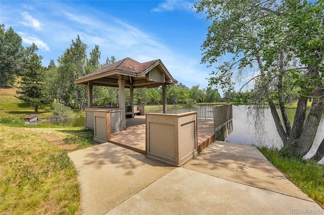 exterior space with a gazebo and a water view