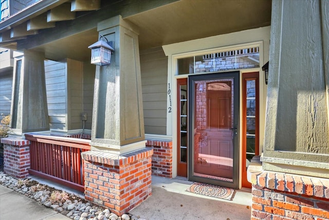 doorway to property featuring a porch