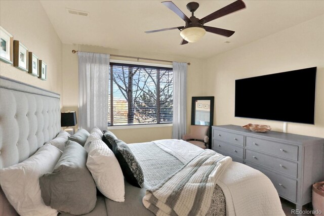 bedroom with visible vents and a ceiling fan