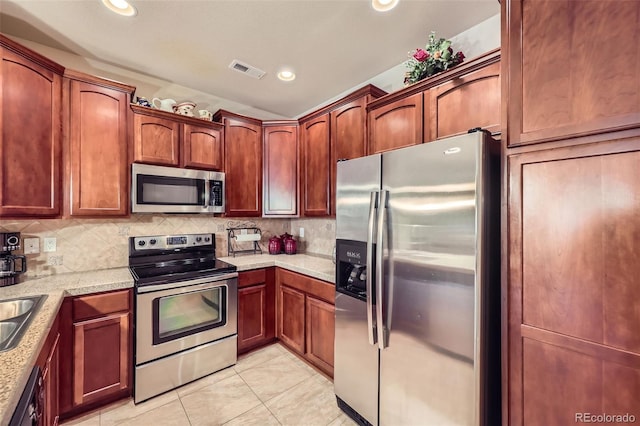 15362 W 66th Ave Unit D, Arvada, CO 80007 - kitchen featuring stainless steel appliances, light tile patterned floors, backsplash, recessed lighting, and a sink