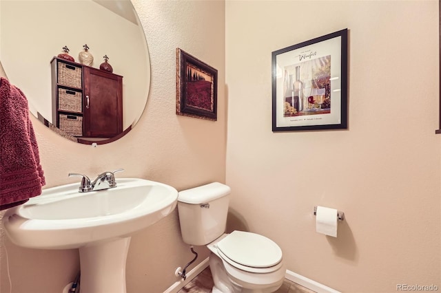 15362 W 66th Ave Unit D, Arvada, CO 80007 - half bathroom with toilet and baseboards