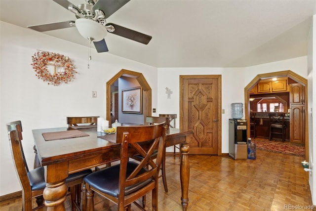 11485 Pecos St, Denver, CO 80234 - dining space with arched walkways and a ceiling fan