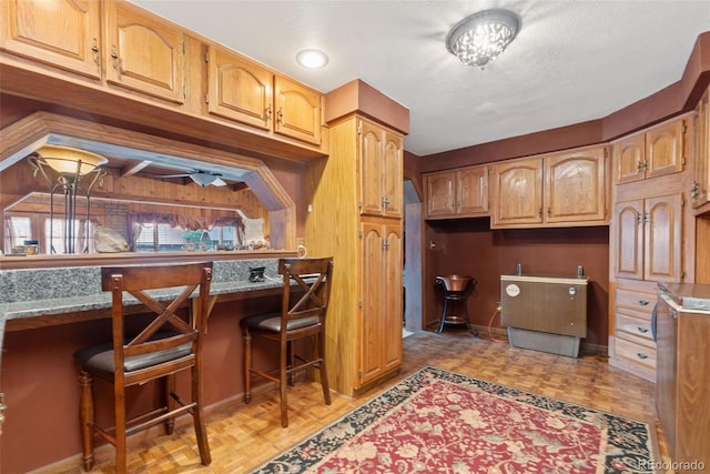 11485 Pecos St, Denver, CO 80234 - kitchen with built in study area and baseboards