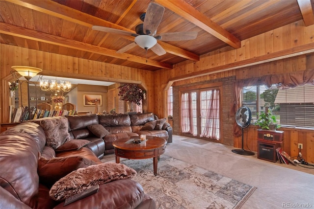 11485 Pecos St, Denver, CO 80234 - carpeted living room with a wooden ceiling with exposed beams, wood walls, a ceiling fan, and a chandelier