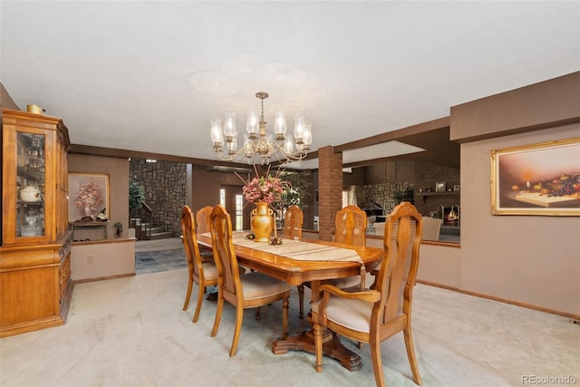 11485 Pecos St, Denver, CO 80234 - dining room featuring light carpet, a chandelier, stairs, and ornate columns