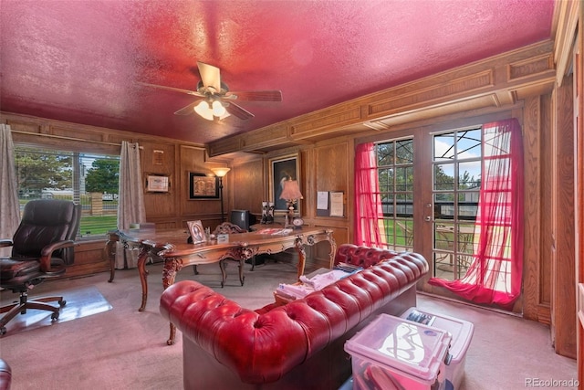 11485 Pecos St, Denver, CO 80234 - carpeted home office with a textured ceiling, french doors, wood walls, and ceiling fan
