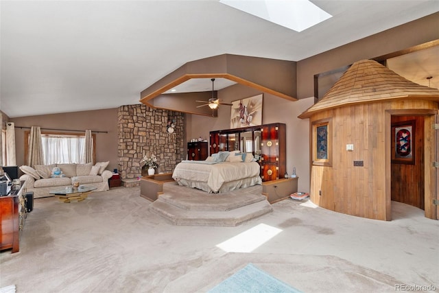 11485 Pecos St, Denver, CO 80234 - carpeted bedroom featuring a skylight, vaulted ceiling, and a stone fireplace