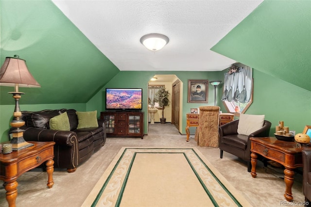 11485 Pecos St, Denver, CO 80234 - living room with carpet floors, arched walkways, lofted ceiling, and a textured ceiling