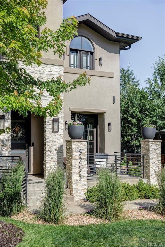 3255 S Birch St, Denver, CO 80222 - view of front of house featuring stucco siding and stone siding