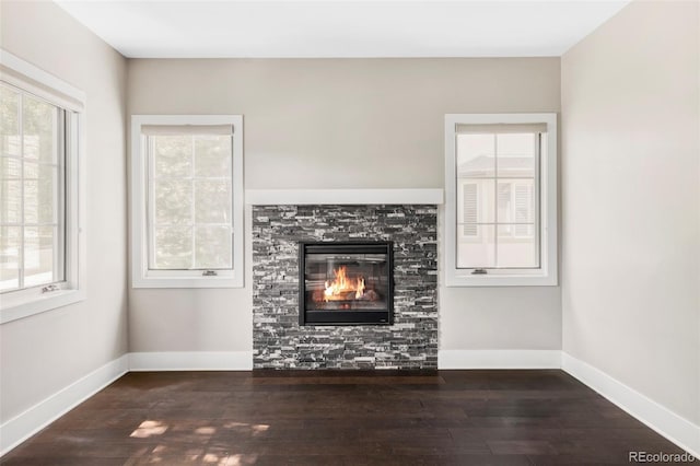 3255 S Birch St, Denver, CO 80222 - unfurnished living room featuring wood-type flooring and a glass covered fireplace