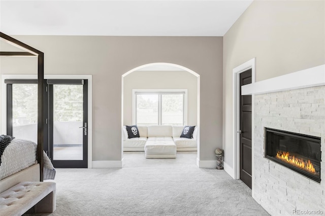 3255 S Birch St, Denver, CO 80222 - living area with carpet floors, a fireplace, and arched walkways