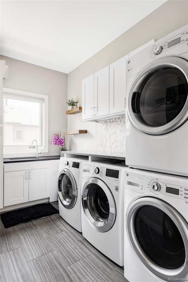 3255 S Birch St, Denver, CO 80222 - washroom featuring washing machine and clothes dryer and cabinet space