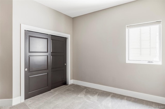 3255 S Birch St, Denver, CO 80222 - unfurnished bedroom with light colored carpet and baseboards