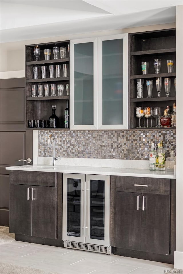 3255 S Birch St, Denver, CO 80222 - indoor wet bar featuring wine cooler and tasteful backsplash