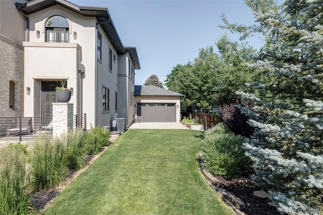 3255 S Birch St, Denver, CO 80222 - view of property exterior with stucco siding and driveway