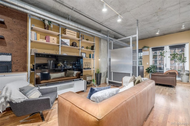 1499 Blake St Unit 4F, Denver, CO 80202 - living room featuring wood finished floors and french doors