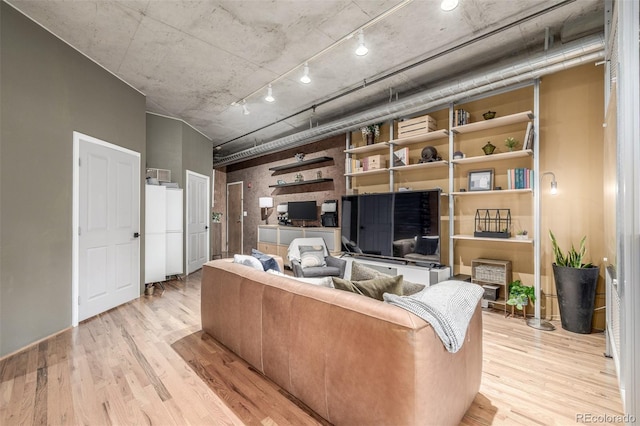 1499 Blake St Unit 4F, Denver, CO 80202 - living room with light wood-type flooring