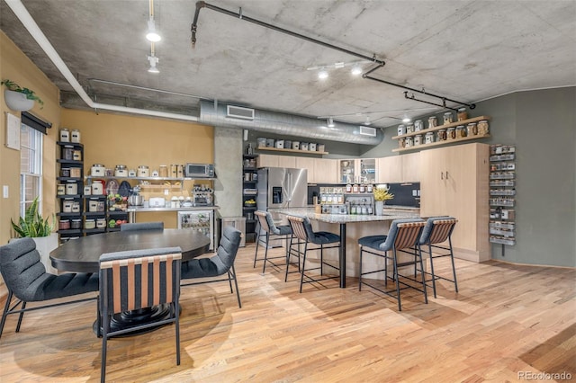 1499 Blake St Unit 4F, Denver, CO 80202 - dining space featuring light wood-style flooring