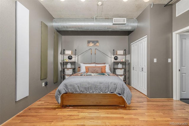 1499 Blake St Unit 4F, Denver, CO 80202 - bedroom featuring wood finished floors