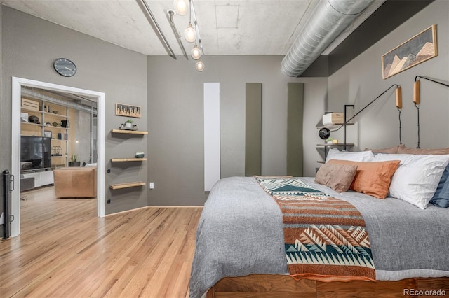 1499 Blake St Unit 4F, Denver, CO 80202 - bedroom featuring wood finished floors
