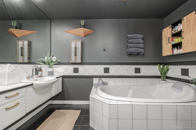 1499 Blake St Unit 4F, Denver, CO 80202 - bathroom featuring vanity, a garden tub, tile patterned floors, and tasteful backsplash