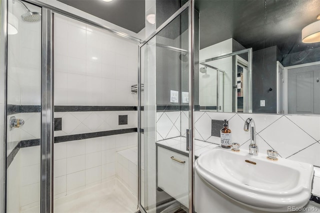 1499 Blake St Unit 4F, Denver, CO 80202 - full bath with a sink, a stall shower, and backsplash