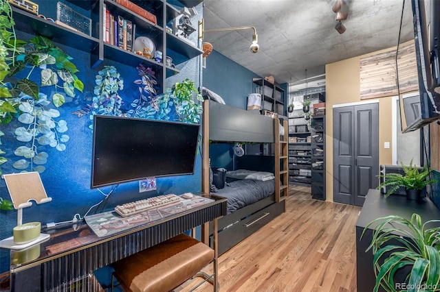 1499 Blake St Unit 4F, Denver, CO 80202 - bedroom with wood finished floors