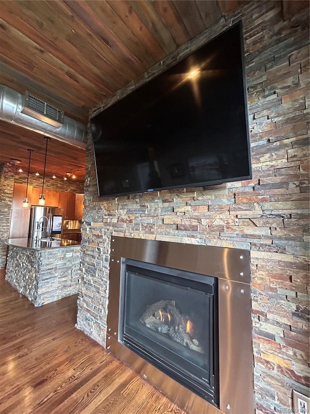 room details with sink and hardwood / wood-style floors