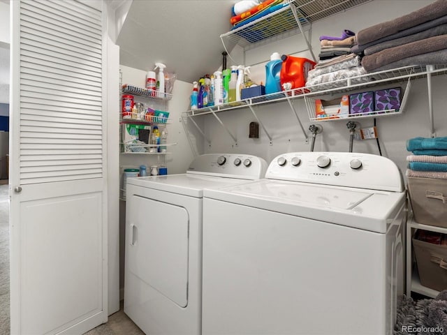 clothes washing area featuring laundry area and washing machine and dryer