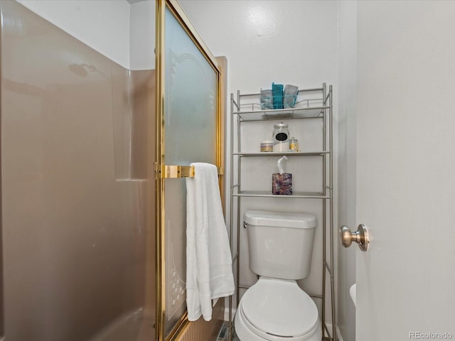 full bathroom with toilet and an enclosed shower